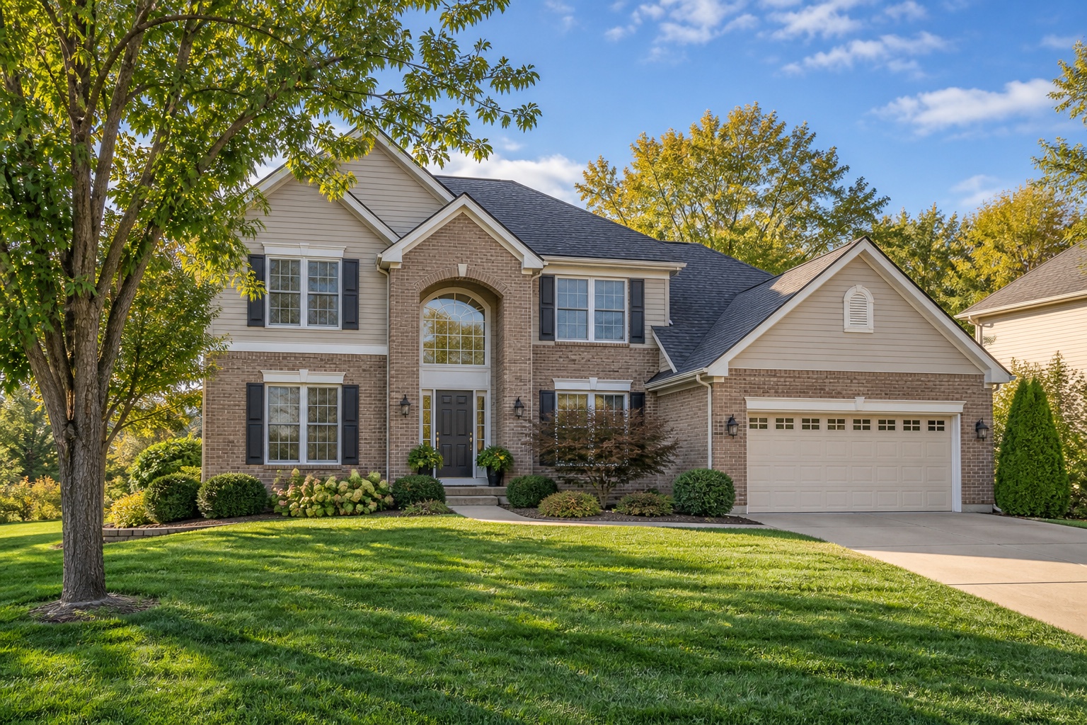 The same Midwest two-story home in daylight